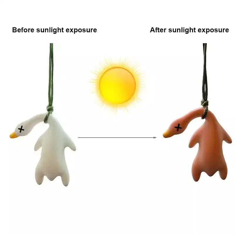 Color-changing roast duck pendant on a cord; white before sun exposure, brown after sun exposure.