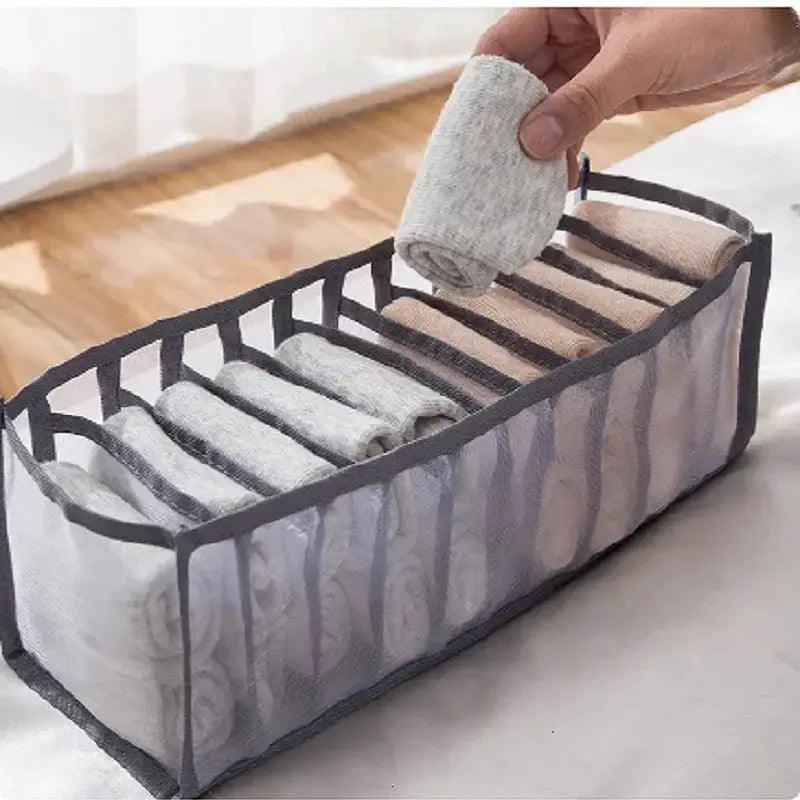 Underwear organizer by Simples Market; 11-compartment collapsible nylon mesh storage in gray with black trim.