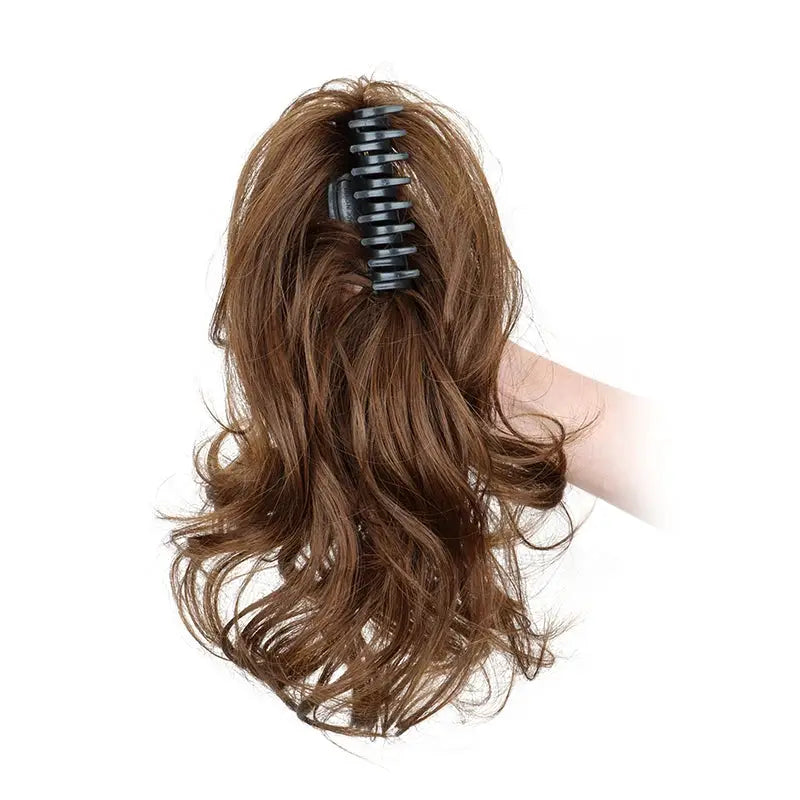 Simples Market 12-inch synthetic curly ponytail extension with black claw clip in brown hair