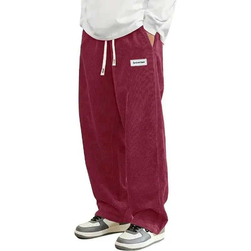Men's burgundy corduroy casual pants by Simples Market, loose baggy fit with drawstring elastic waist