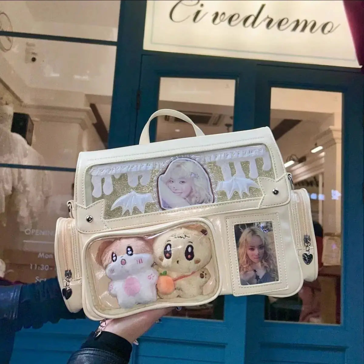 Ita bag backpack in white by Simples Market with clear panels, anime photos, and plush toys