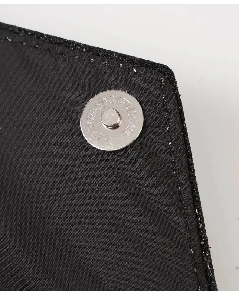 Women envelope evening bag by Simples Market; black fabric clutch with round metal snap closure and neat topstitching