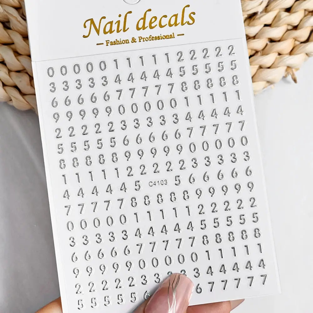 Nail decals sheet by Simples Market with metallic digits in silver, gold and black for manicure