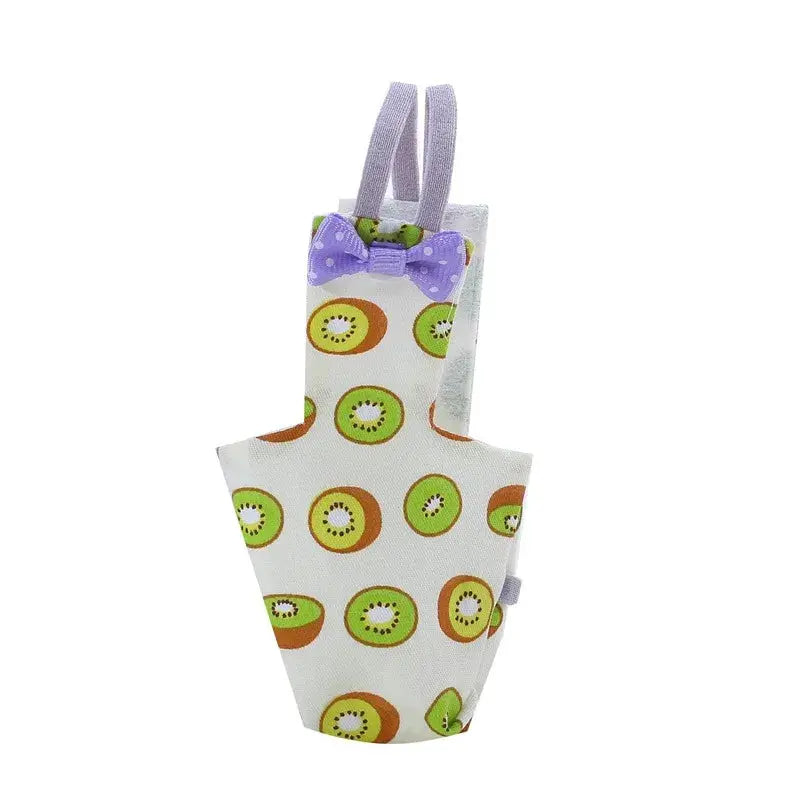 Parrot diaper with bowtie, white fabric with colorful kiwi print, purple bowtie and lavender straps.