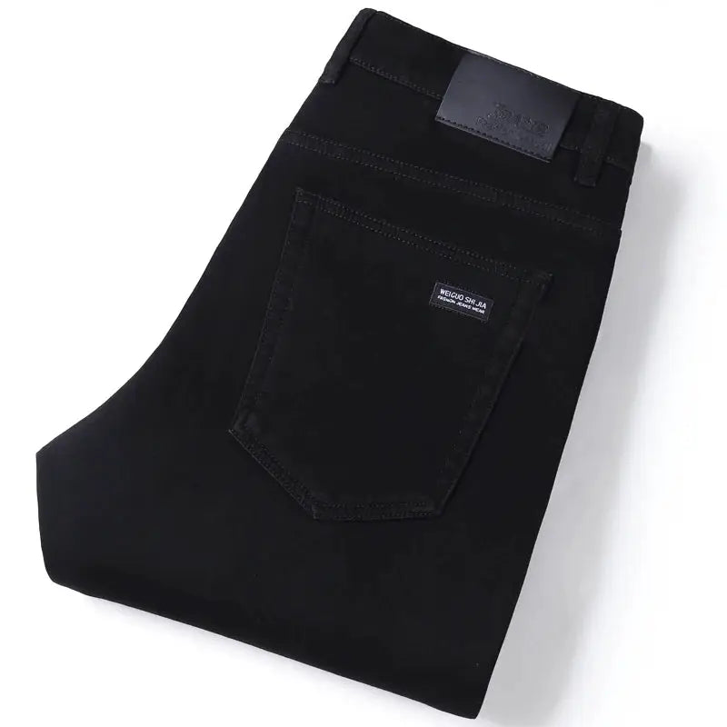 Men's black jeans by Simples Market with back pocket label, soft stretch denim, slim straight fit.