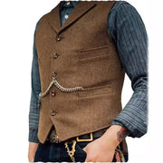 Wool tweed men's vest waistcoat in brown with chain detail, worn over a blue ribbed shirt; groomsman style