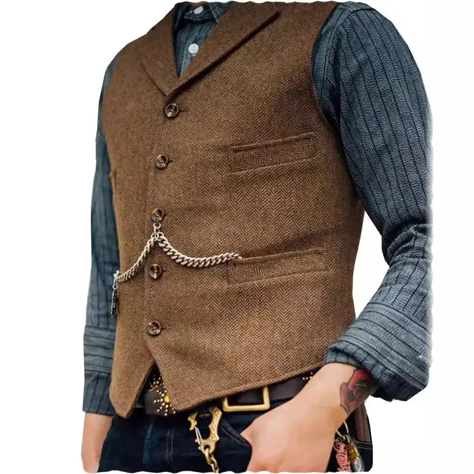 Wool tweed men's vest waistcoat in brown with chain detail, worn over a blue ribbed shirt; groomsman style