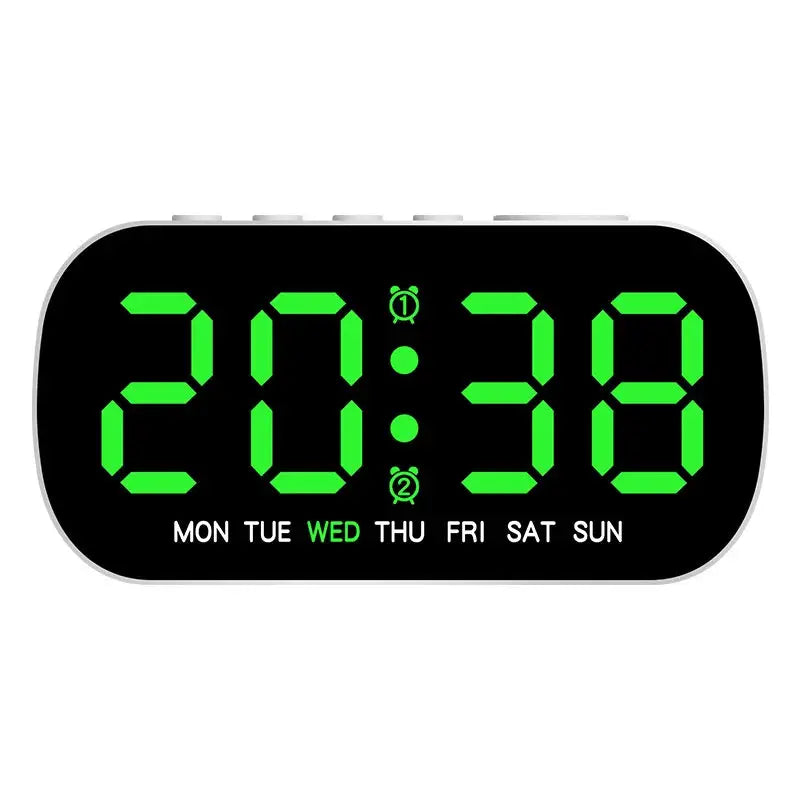 Digital alarm clock with green LED digits on a white-rimmed black display, featuring day-of-week indicator.