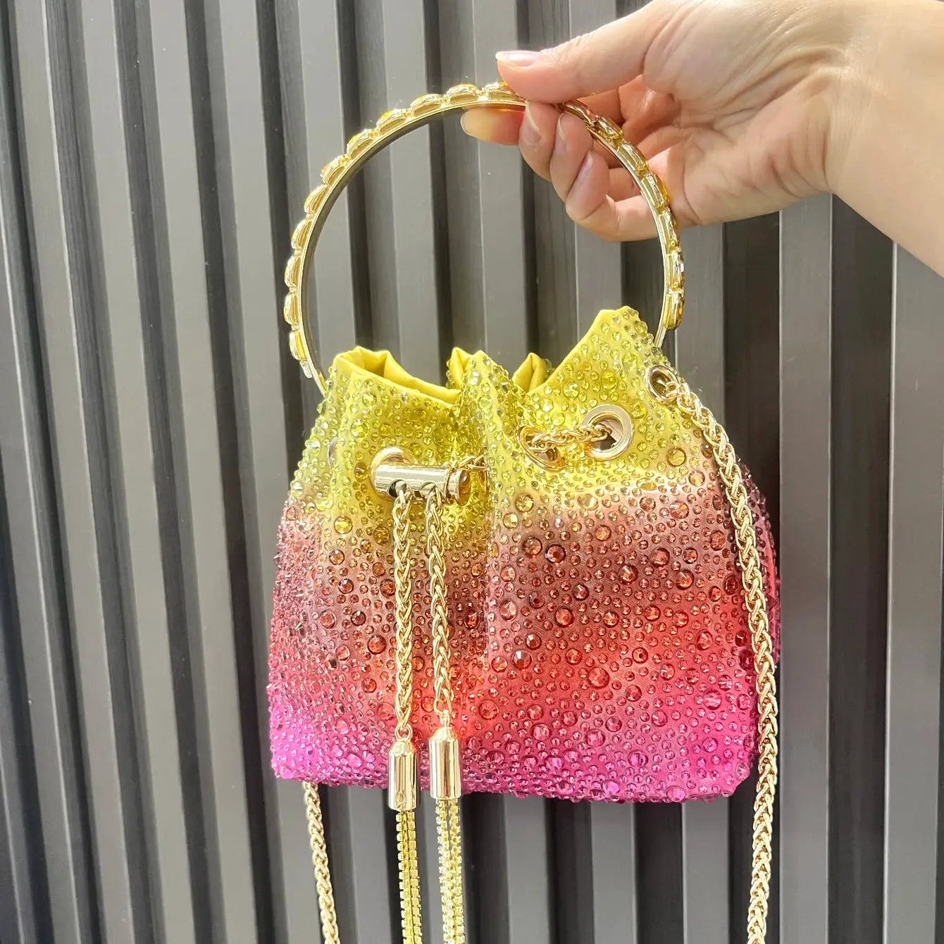 Rhinestone bucket bag evening clutch with yellow to pink gradient, gold ring handle and chain