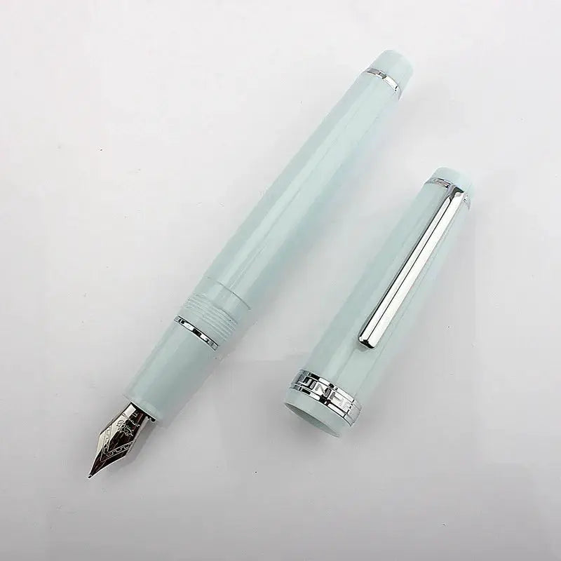 Jinhao 82 fountain pen mint acrylic with gold nib and silver trim, two pieces (cap and body)