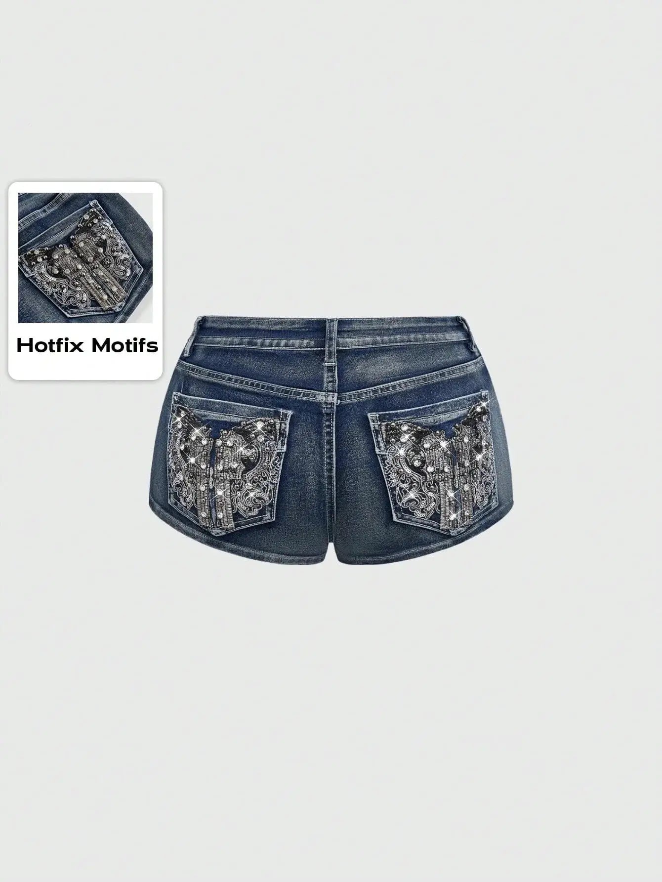 Low rise distressed denim shorts with embroidered back pockets in blue denim.