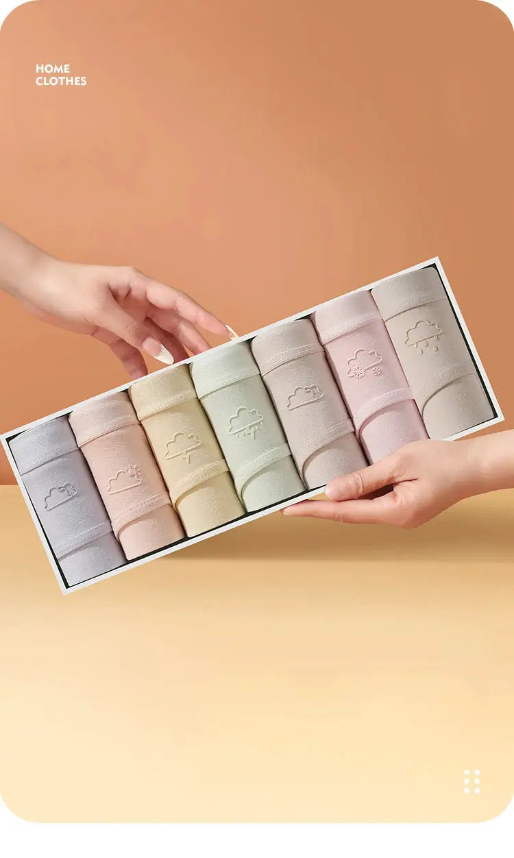 7-pack cotton women’s panties in pastel solid colors, breathable low-waist briefs displayed in a box