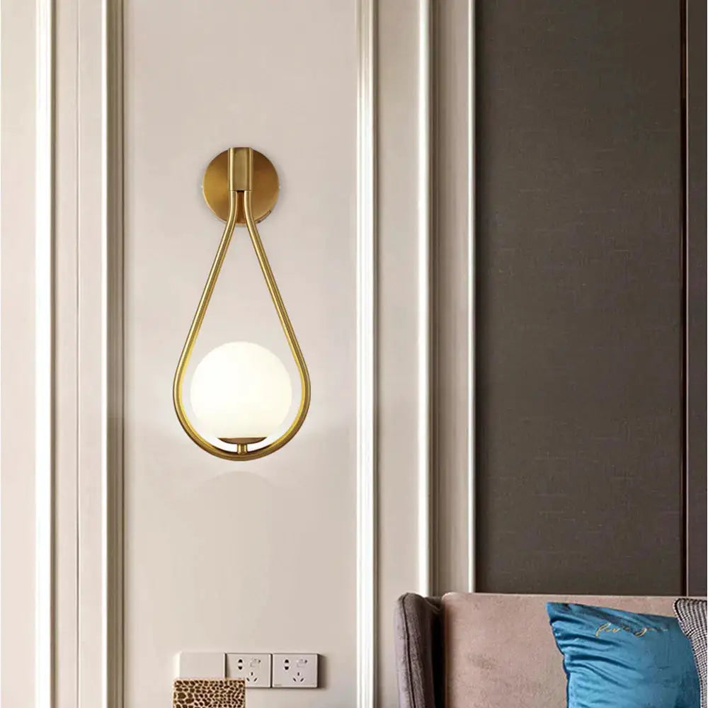 Nordic glass-ball LED wall lamp by Simples Market; gold metal teardrop frame with white glass globe, wall mount