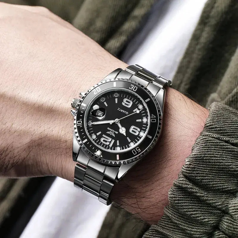 Men's stainless steel quartz wristwatch with black dial, silver bezel, date window, and metal bracelet.