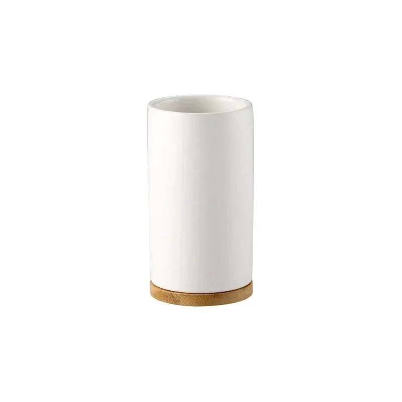 Ceramic bathroom tumbler with white glaze and natural wooden base