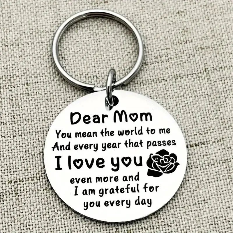 Stainless steel round keychain with engraved Dear Mom I Love You message and a rose motif.