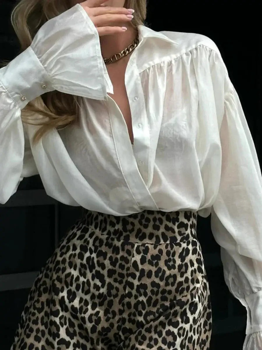 Bornladies two-piece outfit: white loose collared shirt with flare sleeves and leopard-print skirt