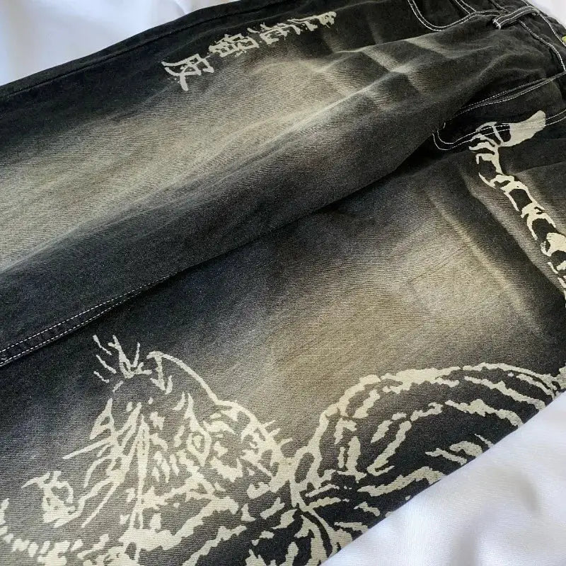 Men's oversized baggy dark denim jeans with white graphic print, high-waist wide-leg style