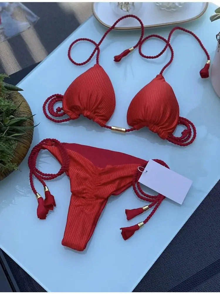 Women backless rope triangle bikini by Simples Market in red; braided straps with tassel ends.
