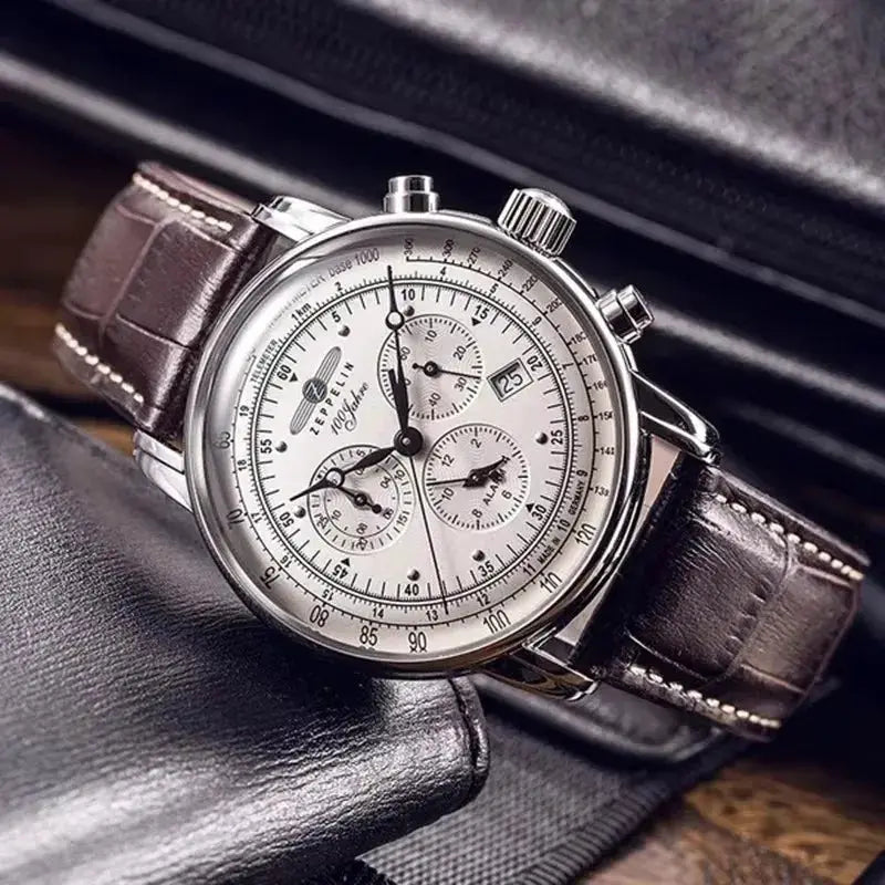 Zeppelin airship commemorative men's automatic watch with silver case, white dial, brown leather strap.