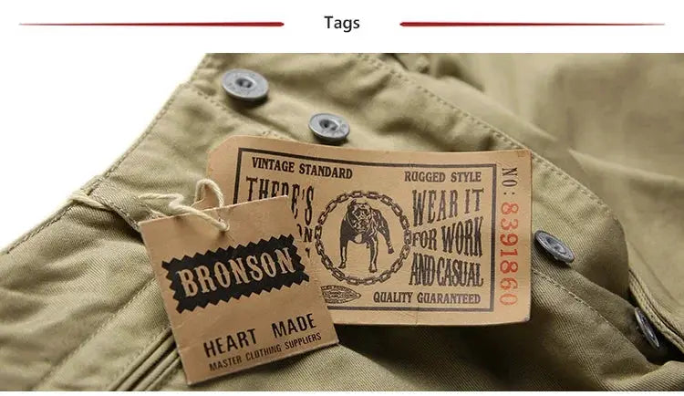 Rugged Bronson army chino trousers in khaki, 1942 pattern military-style casual pants; vintage tag labels visible.