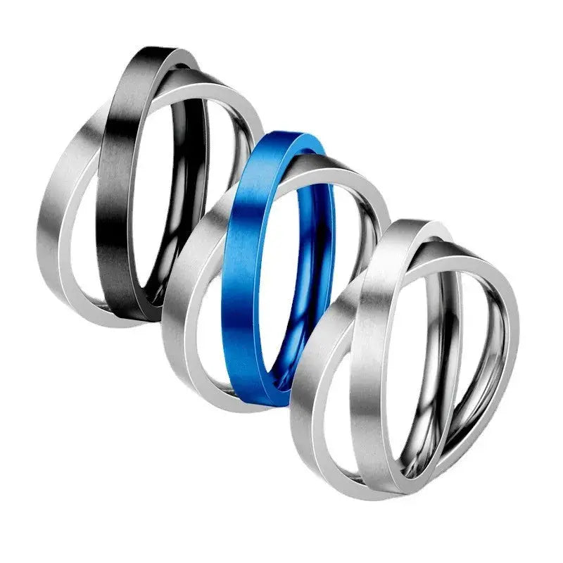 Anti-stress spinner ring set; 4 stainless steel knuckle rings in black, blue and silver tones