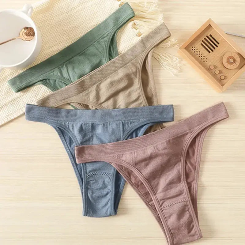 Women's ribbed low-rise thong underwear set of four by Simples Market in green, beige, blue and pink; cotton gusset.