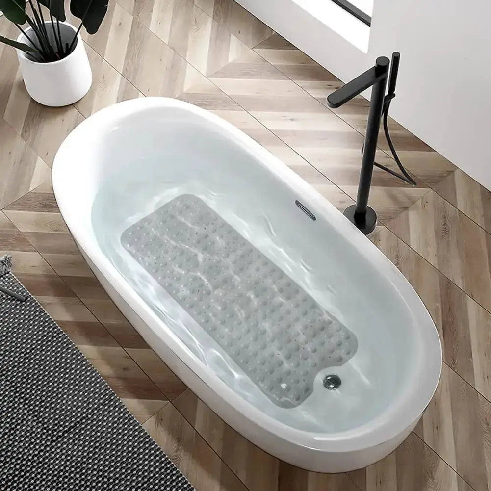 Bathtub mat 40 x 16 in, non-slip gray bath mat with drain holes and suction cups inside a white bathtub.