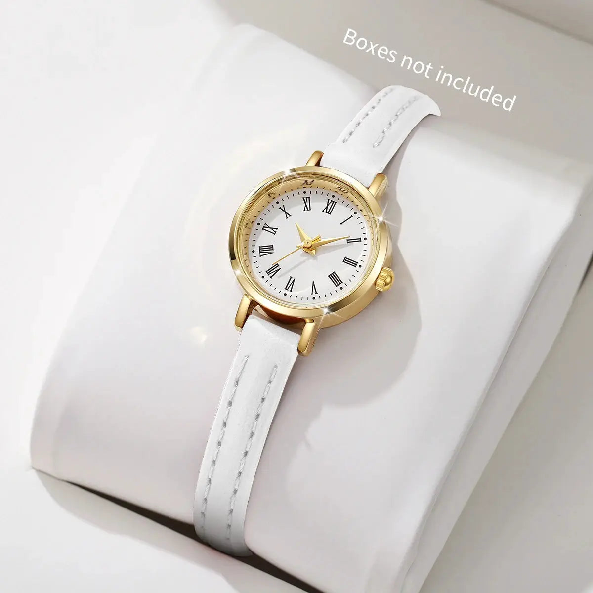 Women’s fashion watch with white leather strap, gold-tone case, and Roman numeral dial