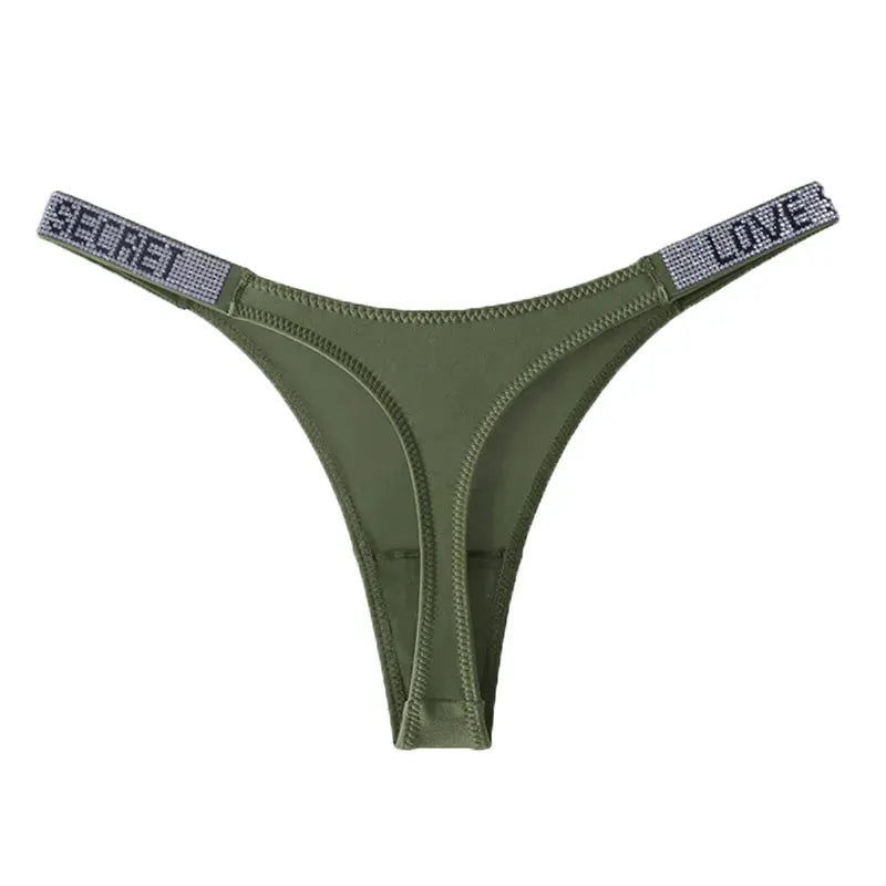 Low-waist G-string thong by Simples Market in olive green with rhinestone straps reading SECRET and LINE.