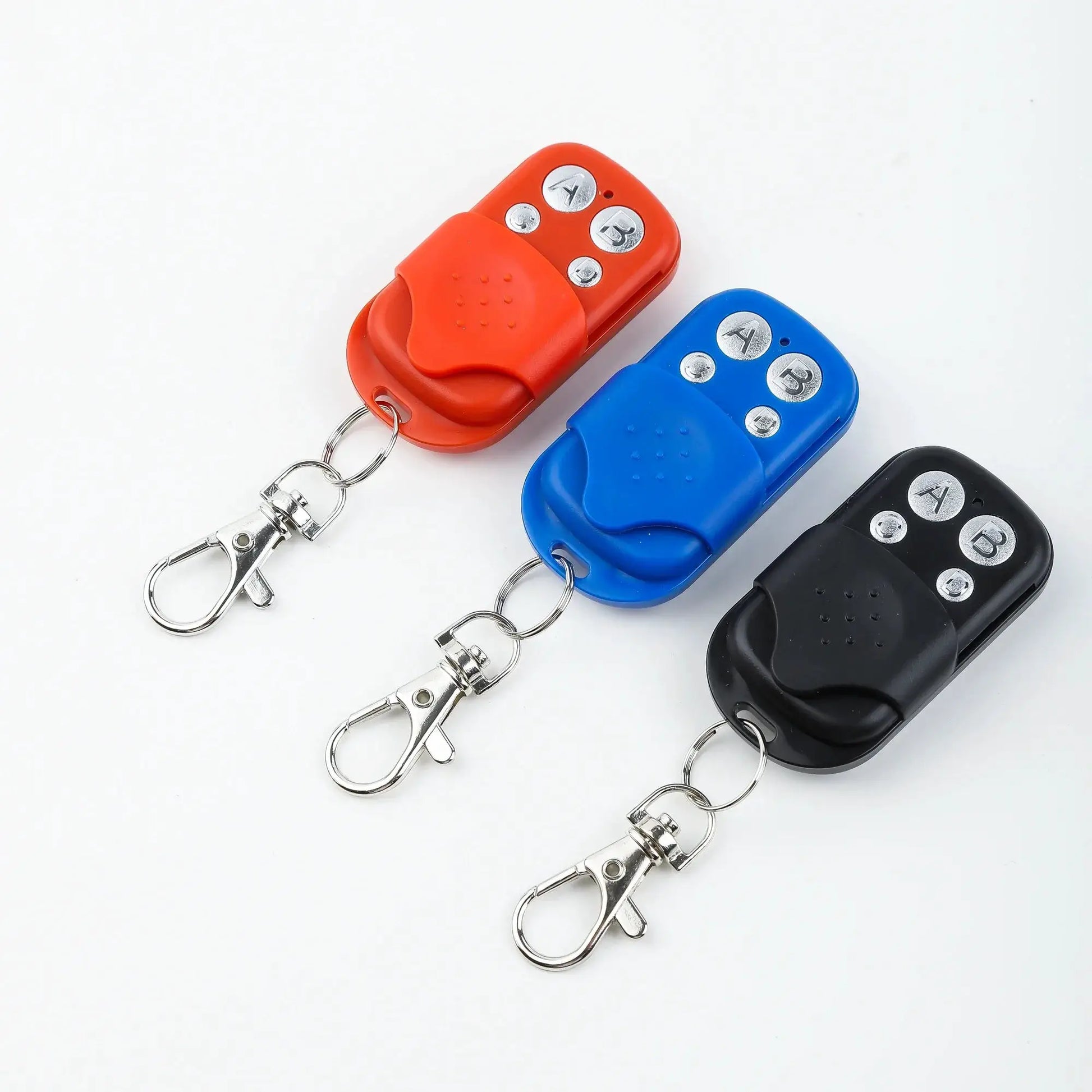Universal garage door opener remotes set of three in red, blue and black with key rings