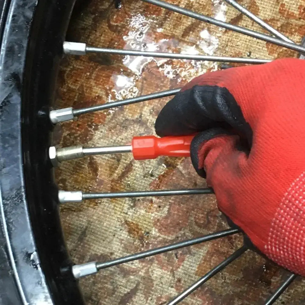 Copper tire valve core removal tool kit with red-handled zinc-plated wrench