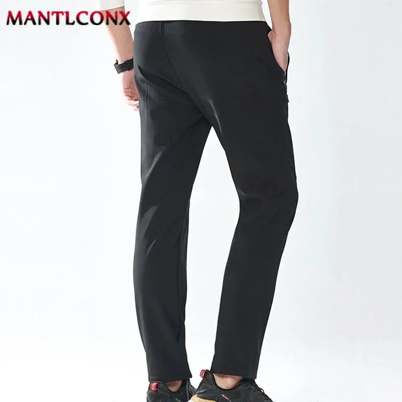 Men's black breathable quick-dry jogger pants with elastic waist and straight-leg fit, Simples Market 4XL–5XL.