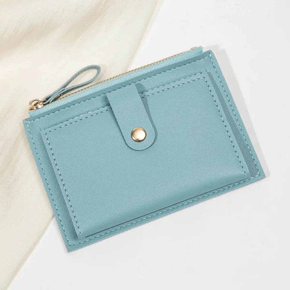 Simples Market minimalist ultra-thin short card wallet in light blue PU leather with zipper and snap strap