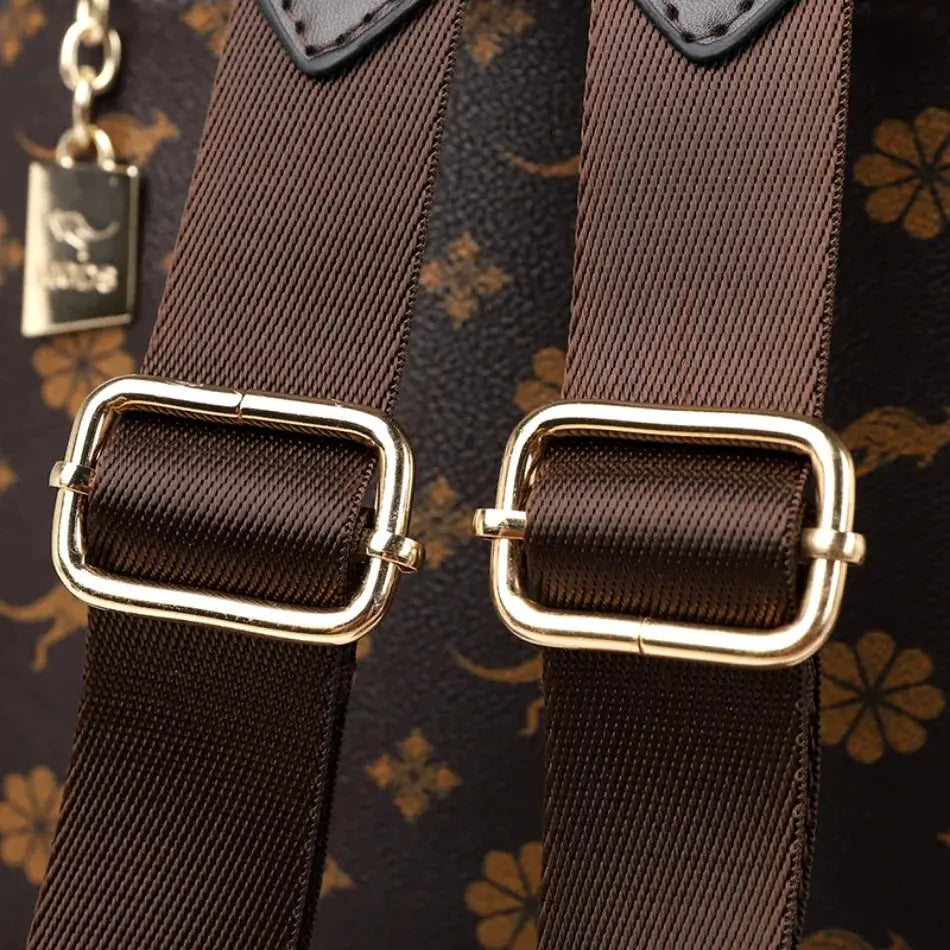 Ladies backpack by Simples Market with brown webbing straps and gold-tone buckles