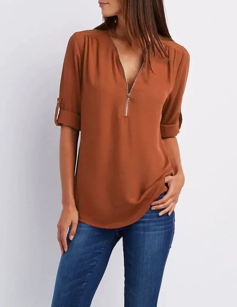 Women's rust chiffon blouse with deep V-neck zipper, loose fit and rolled sleeves.