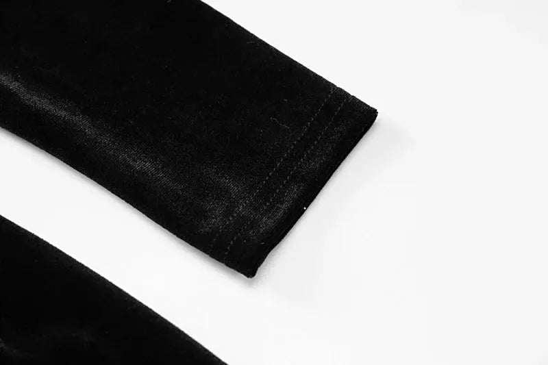 Dulzura Autumn Velvet long-sleeve jumpsuit fabric close-up in black velvet