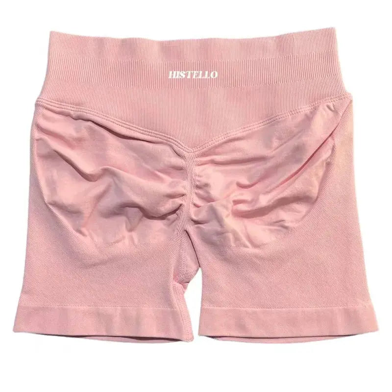 HISTELLO pink women's sports shorts with low waist and scrunch back detail, breathable fabric.