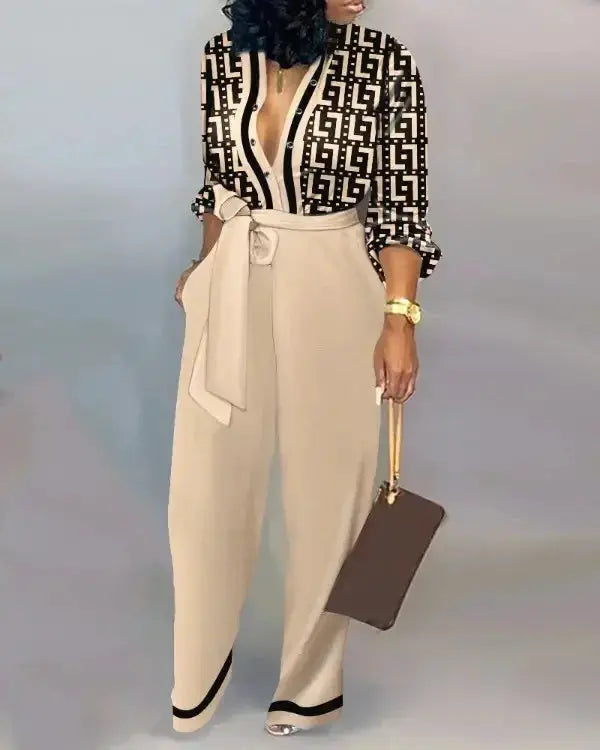 Beige wide-leg jumpsuit with a self-tie belt, paired with a black-and-white letter-print top