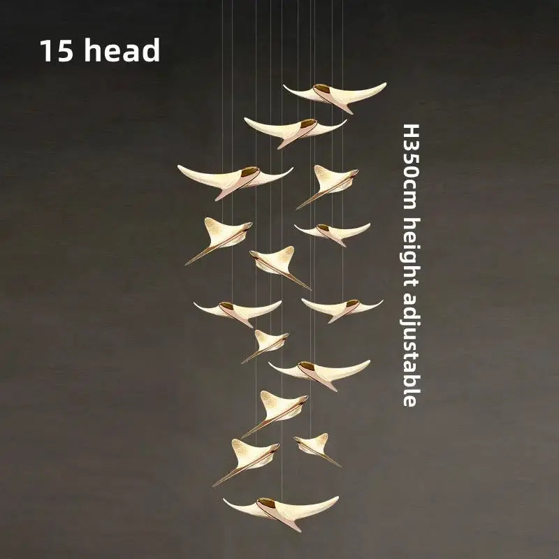 Seagull staircase pendant lamp by Simples Market, 15 gold seagull-shaped lights cascading in an adjustable fixture