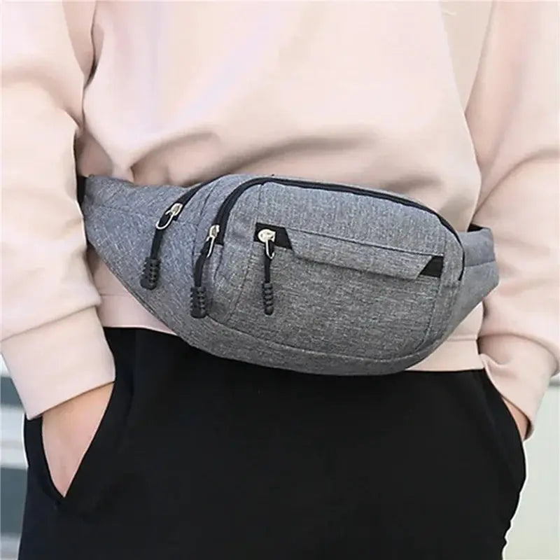 Waist bag in gray fabric with dual zip pockets and adjustable strap