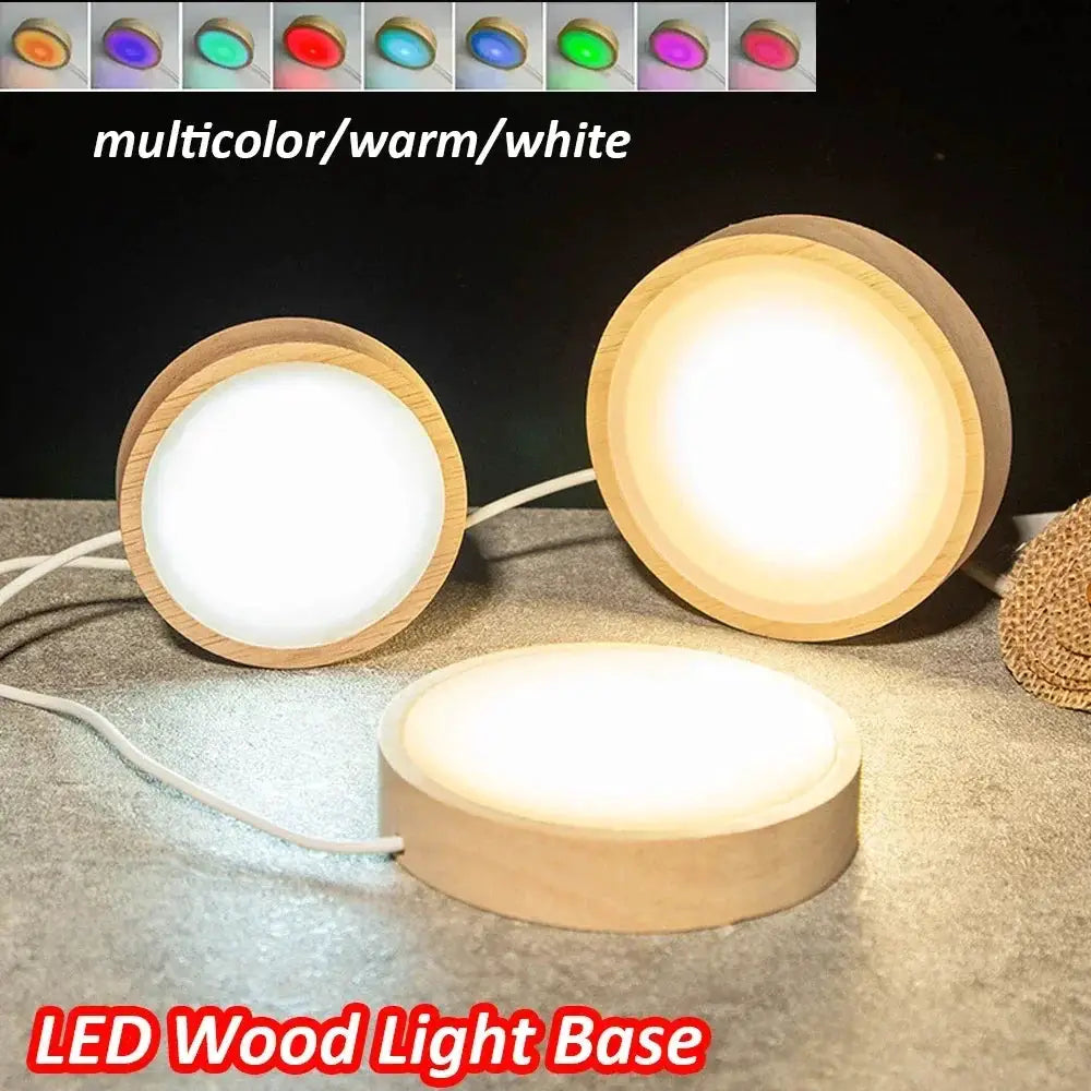 3 round wooden LED night light bases with warm, white, and multicolor lighting