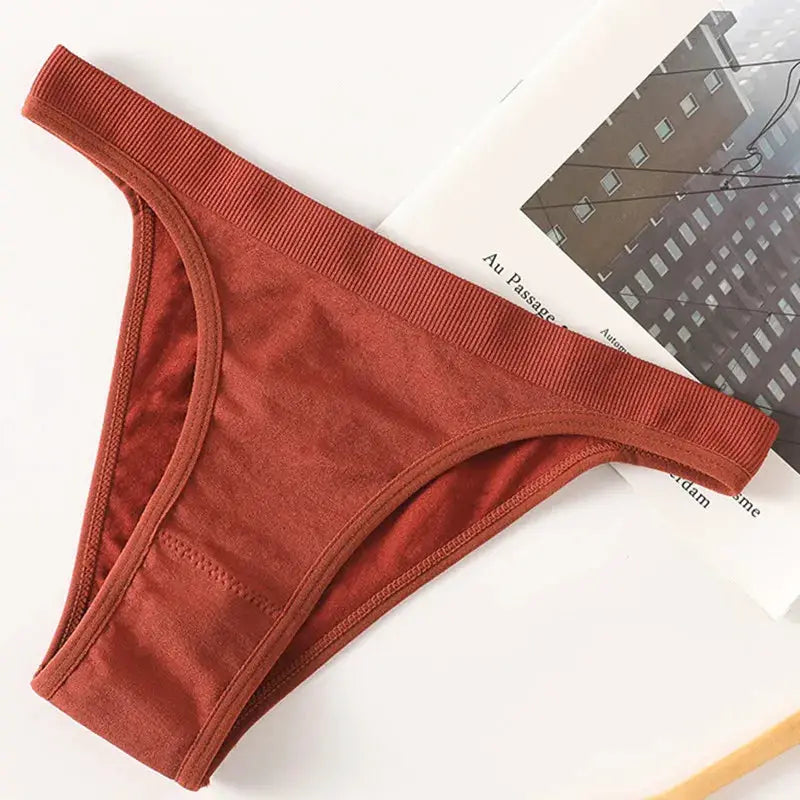 Women ribbed low-rise thong panties with high-leg cut in rust red, breathable cotton gusset