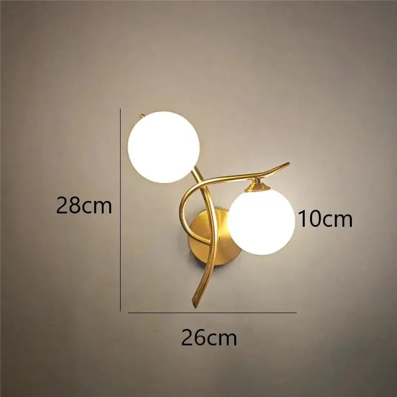 Nordic modern iron wall lamp with two glass globe bulbs in brass finish