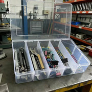Simples Market 5-compartment transparent hardware organizer box with lid holding pliers and assorted fasteners.
