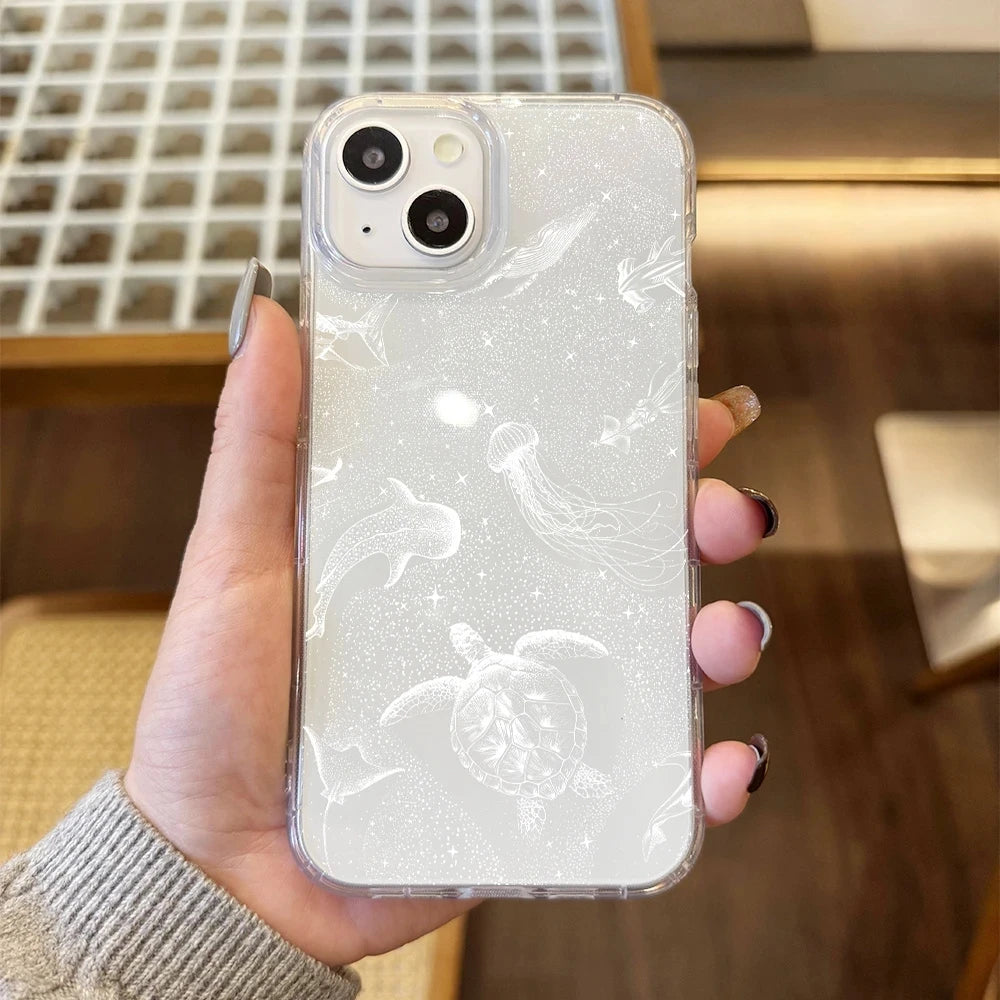 Phone case for iPhone, clear glittery ocean design with white turtle and jellyfish line art