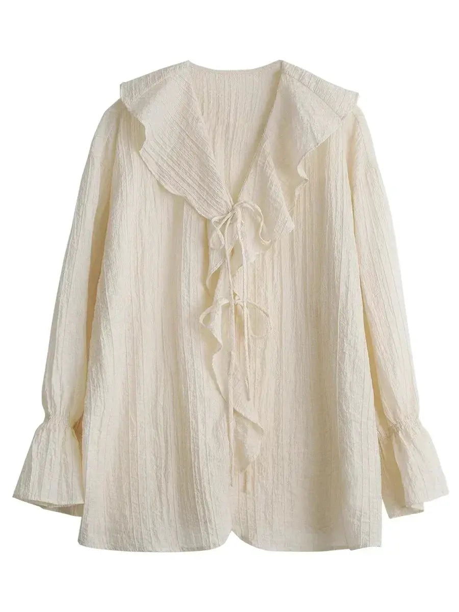 ChicVen women's blouse in cream; V-neck lace-up with ruffled front, crinkle fabric, and bell cuffs.