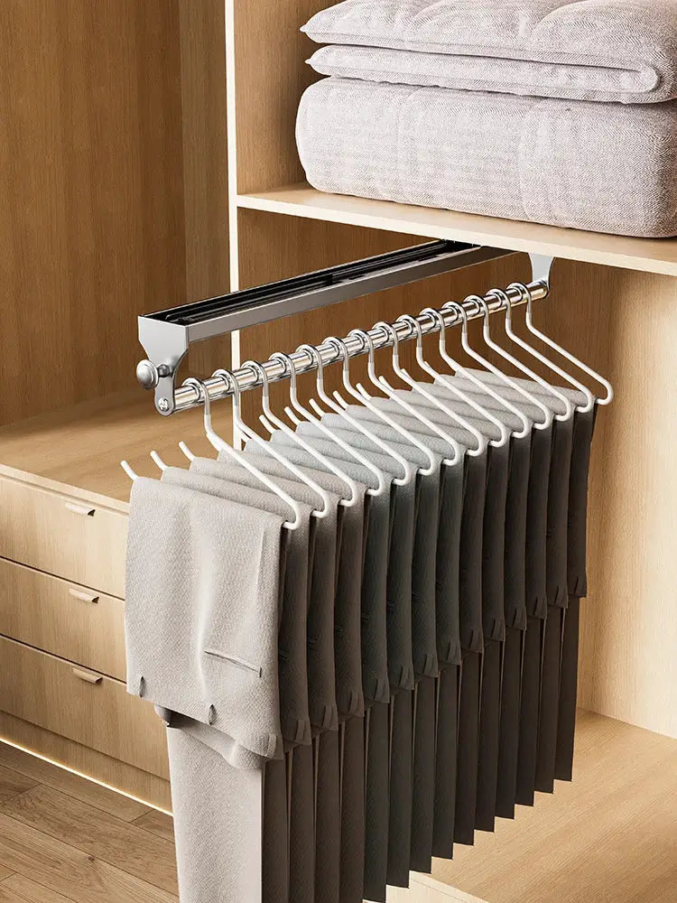 Pull-out trouser hanger wardrobe organizer by Simples Market with non-slip hangers on metal rail
