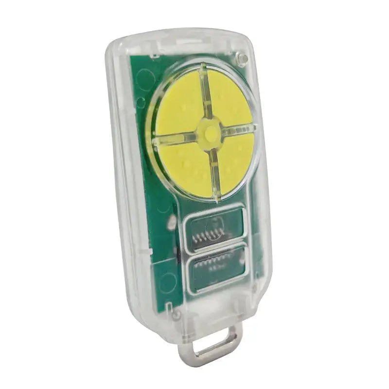 Universal garage door remote in a clear case with a yellow circular LED module on a green PCB.