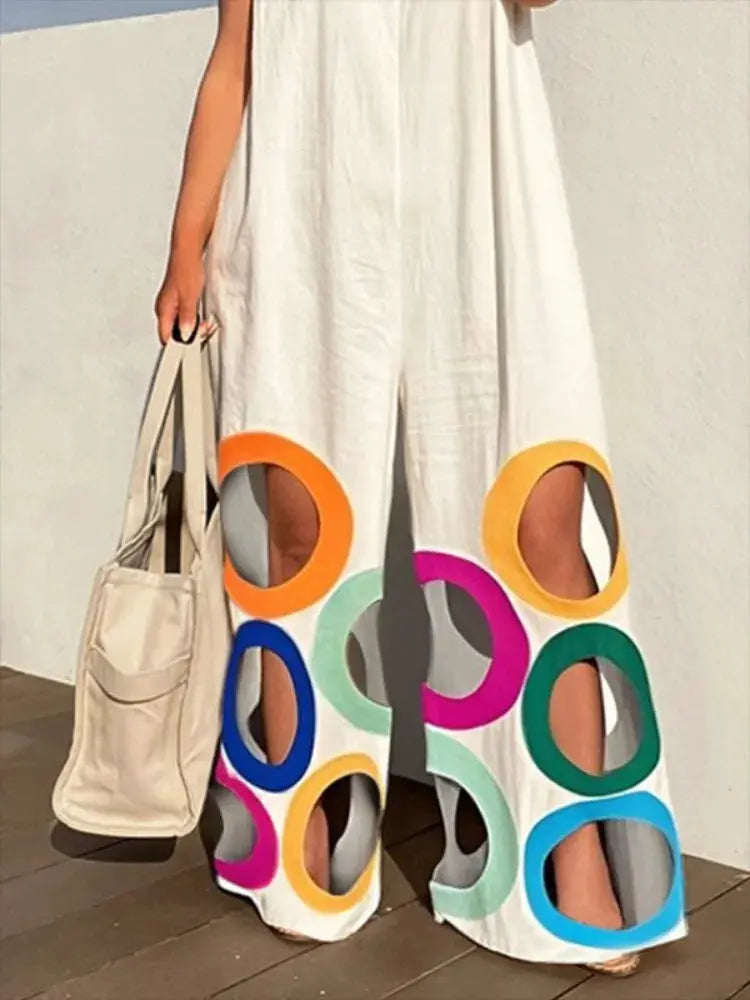 Yeezzi sleeveless white wide-leg jumpsuit with rainbow hollow circle cutouts at the hem